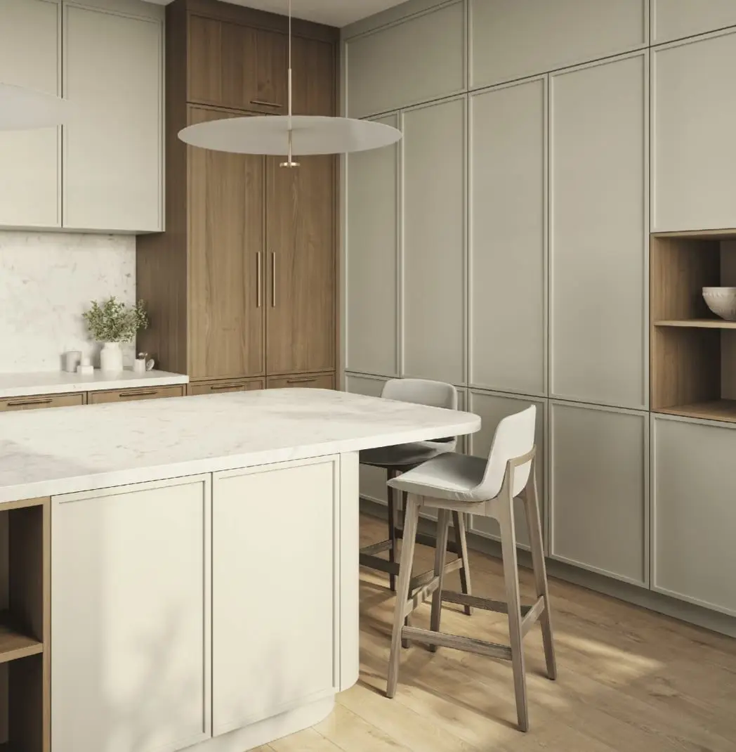 A finished Cabico kitchen: sage panelled cabinetry, a walnut pantry wall and a marble island with bar stools